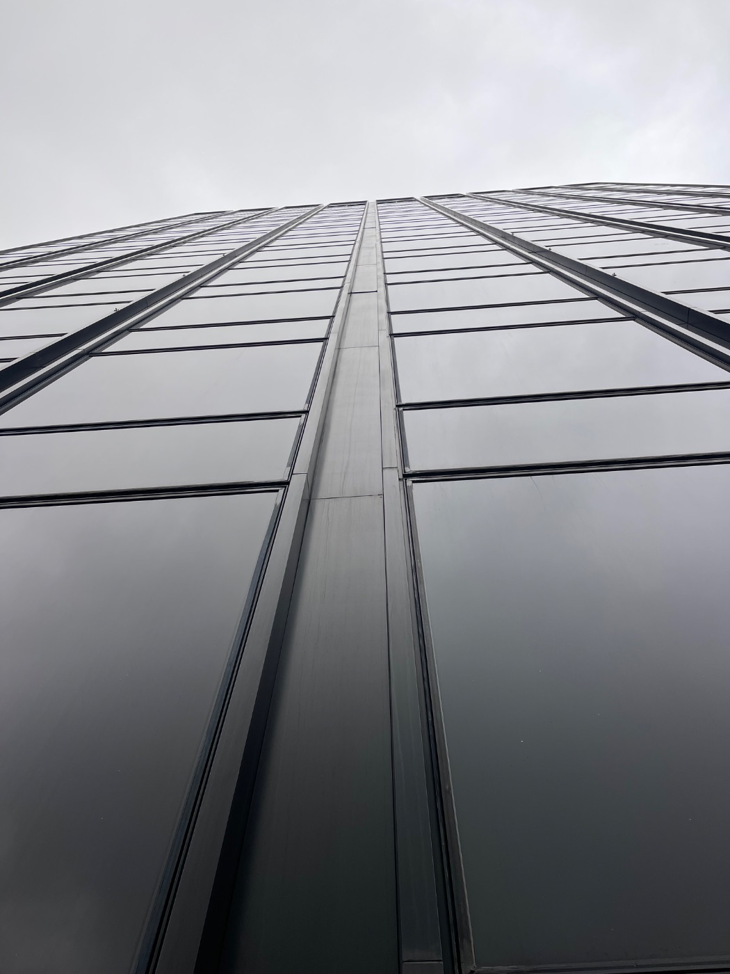Glass curtain wall facade seen from below